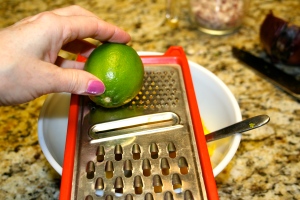 Grate your lime in with the mango getting as much of the lime rind as you can.