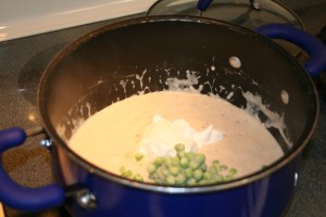 Reduce heat to low and stir in the parmesan cheese, cream cheese, nutmeg and pepper. Stir until cheese is melted. Then add sour cream and peas and cook until heated.