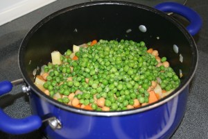Add the chickpeas and peas.