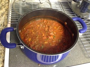 Once the veggies have cooked down, add the lentils and fresh basil. Mix together until lentil are heated through.